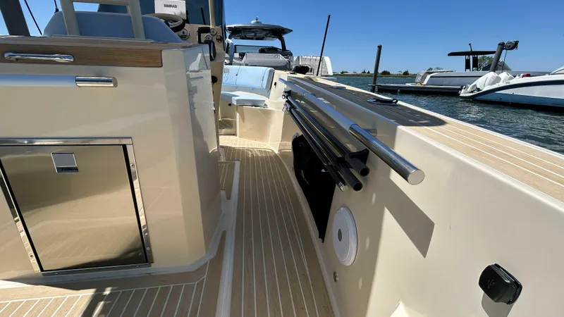 Slide: The Image of 2025 Lilybaeum Levenzo boat interior with sleek design and modern amenities, docked by the water. - 16