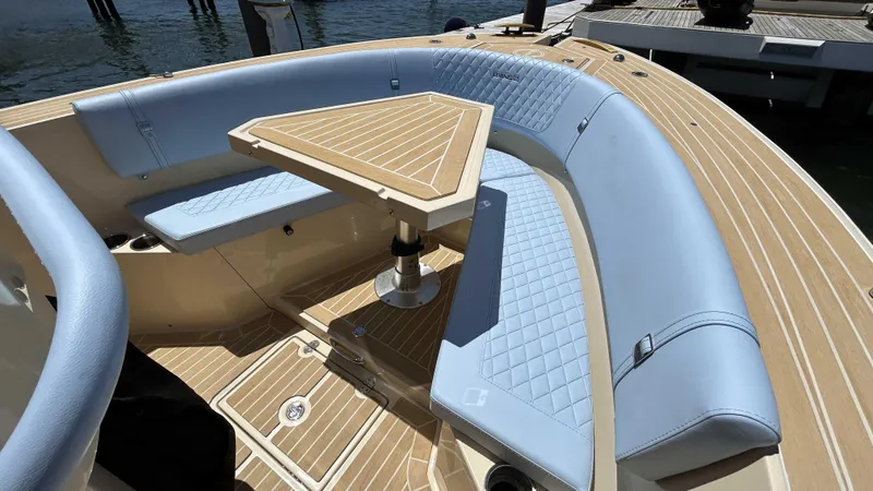 Slide: The Image of Luxurious seating area on 2025 Lilybaeum Levenzo boat with elegant wood and leather design. - 20