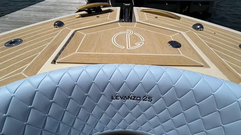 Slide: The Image of Luxury Lilybaeum Levenzo 2025 boat with elegant wood deck and quilted seating. - 23