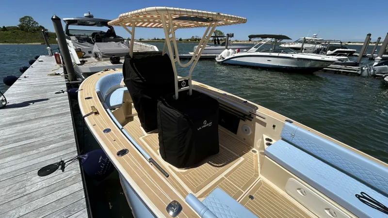 Slide: The Image of 2025 Lilybaeum Levenzo boat docked at marina, featuring sleek design and modern amenities. - 6