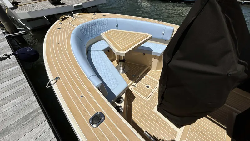 Slide: The Image of Luxury Lilybaeum Levenzo 2025 boat with elegant wood deck and cushioned seating. - 7