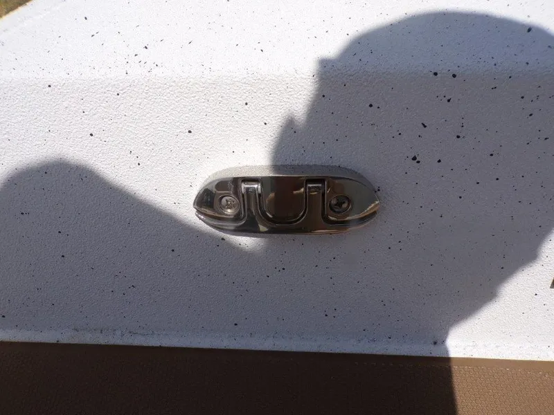 Slide: The Image of Close-up of a metal fixture on a 2026 Xpress XP20CC boat surface. - 11