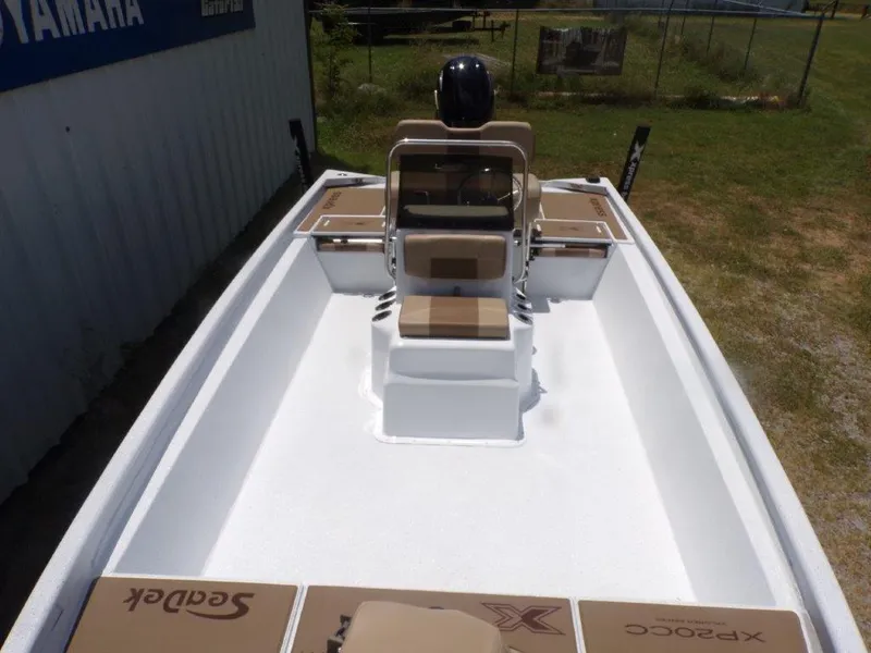 Slide: The Image of 2026 Xpress XP20CC boat interior with seating and storage compartments. - 12