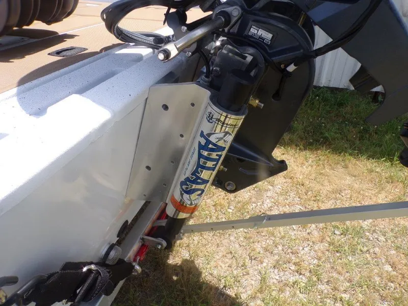 Slide: The Image of 2026 Xpress XP20CC boat with Atlas hydraulic jack plate on grassy surface. - 19