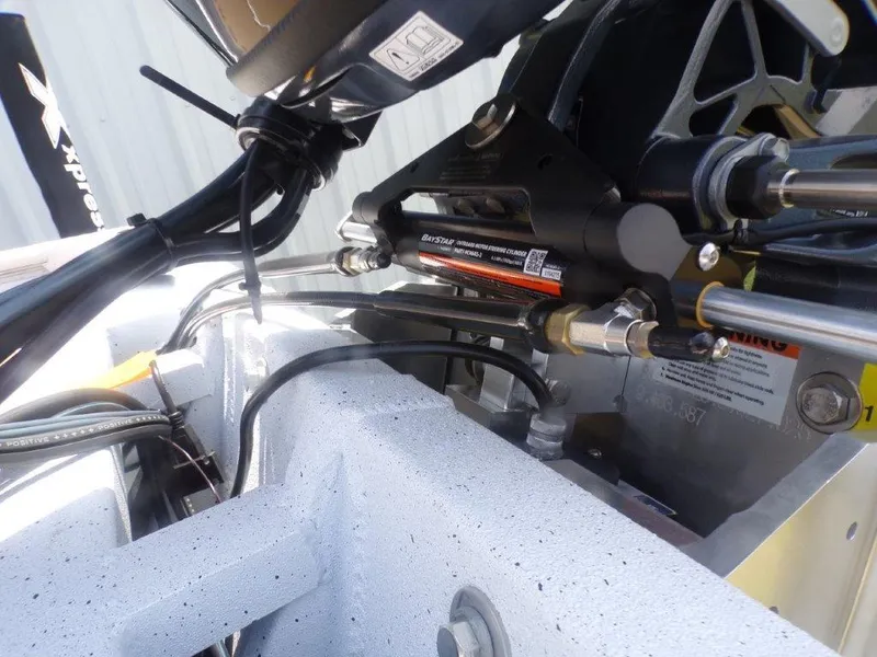 Slide: The Image of Close-up of 2026 Xpress XP20CC boat's hydraulic steering system components. - 20
