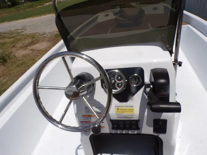 Slide: The Image of 2026 Xpress XP20CC boat console with steering wheel and control panel. - 6