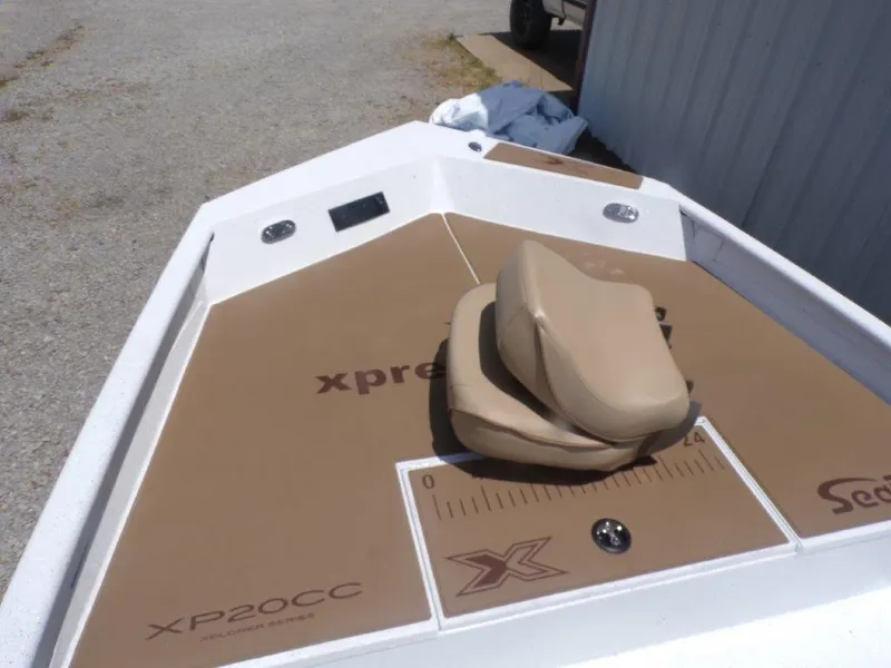 Slide: The Image of 2026 Xpress XP20CC boat deck with tan seating and measuring board. - 9