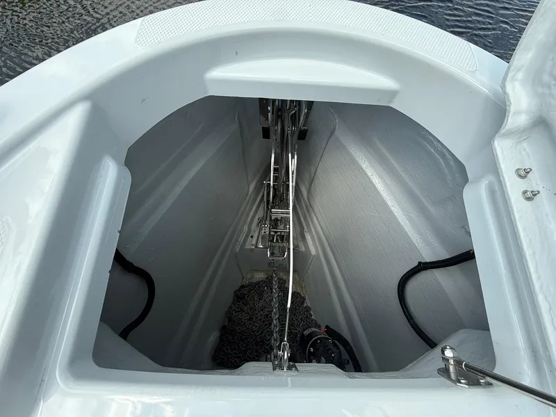 Slide: The Image of Anchor compartment of 2024 Saxdor 320 GTO boat, featuring chain and winch system. - 11