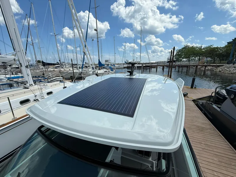 Slide: The Image of 2024 Saxdor 320 GTO with solar panel docked at marina under blue sky. - 14