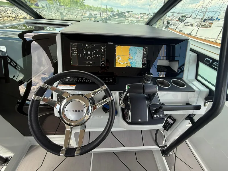 Slide: The Image of 2024 Saxdor 320 GTO helm with advanced navigation display and controls. - 16