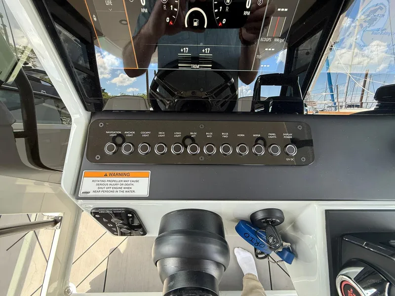 Slide: The Image of 2024 Saxdor 320 GTO dashboard with control panel and warning label. - 19