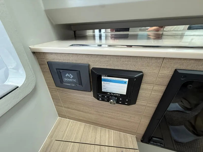 Slide: The Image of 2024 Saxdor 320 GTO interior with Dometic and JL Audio control panels. - 26