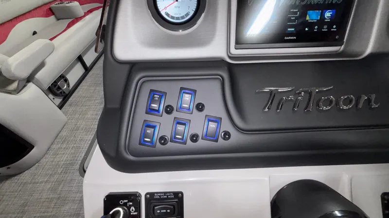 Slide: The Image of Control panel of 2025 JC Neptoon 25TT Sport boat with switches and display. - 22