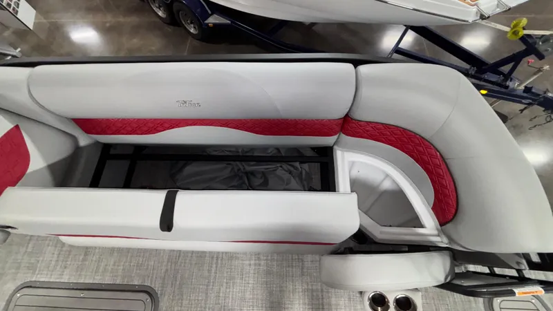 Slide: The Image of 2025 JC Neptoon 25TT Sport boat interior with red and gray seating, overhead view. - 29