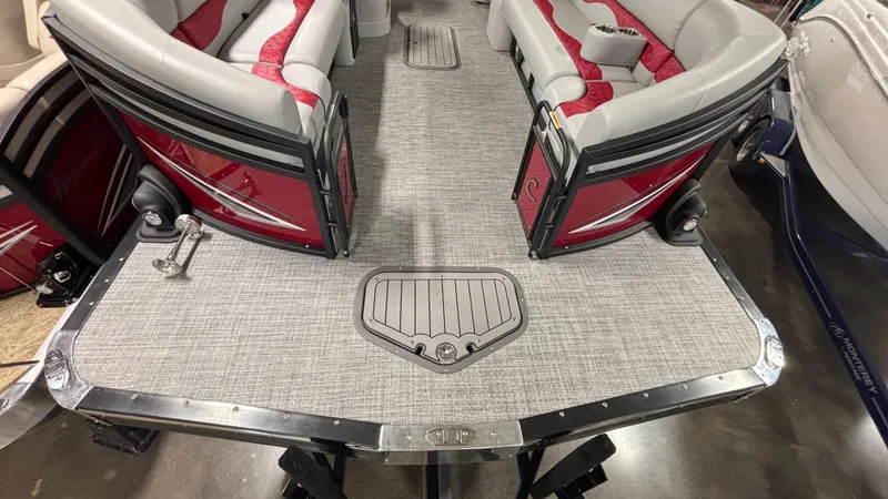 Slide: The Image of 2025 JC Neptoon 25TT Sport pontoon boat with red and gray seating and sleek deck design. - 4