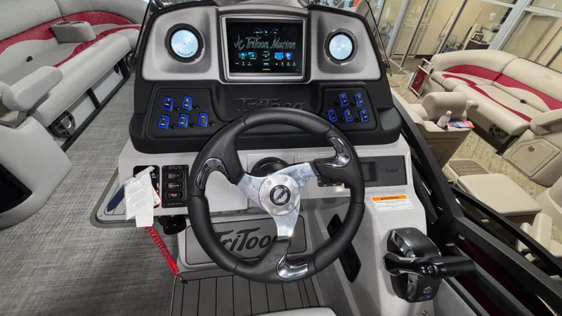 Slide: The Image of 2025 JC Neptoon 25TT Sport dashboard with steering wheel and control panel. - 21