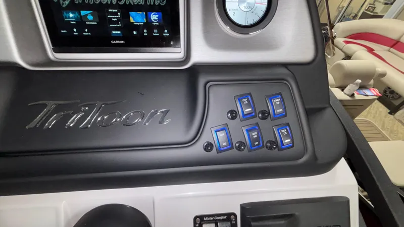 Slide: The Image of Control panel of 2025 JC Neptoon 25TT Sport boat with Garmin display and switches. - 23