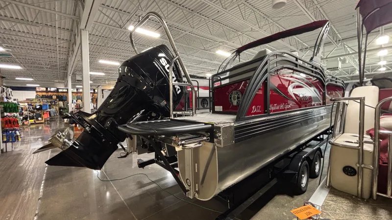 Slide: The Image of 2025 JC Neptoon 25TT Sport pontoon boat with Suzuki outboard motor in showroom. - 32