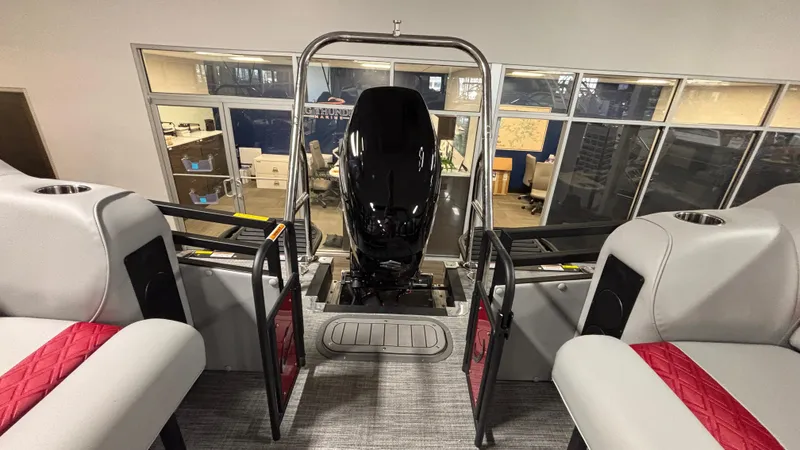 Slide: The Image of 2025 JC Neptoon 25TT Sport boat interior with modern seating and engine view. - 8