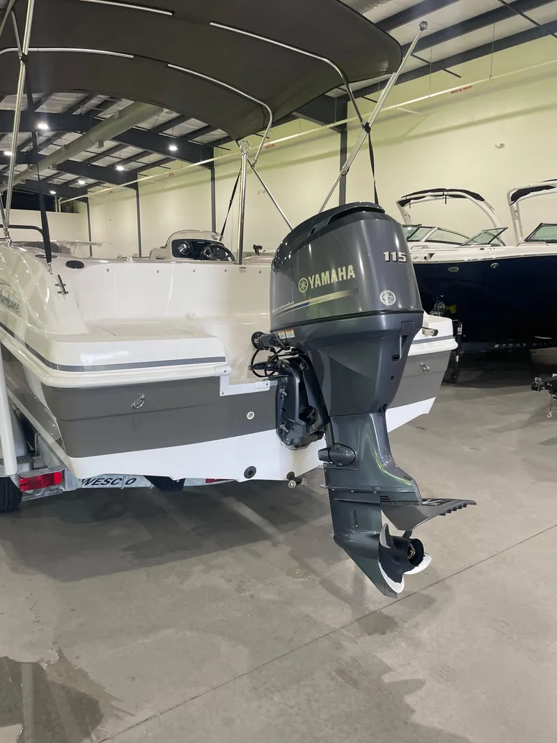 Slide: The Image of 2014 Hurricane SunDeck Sport 188 OB with Yamaha 115 outboard motor in showroom. - 4