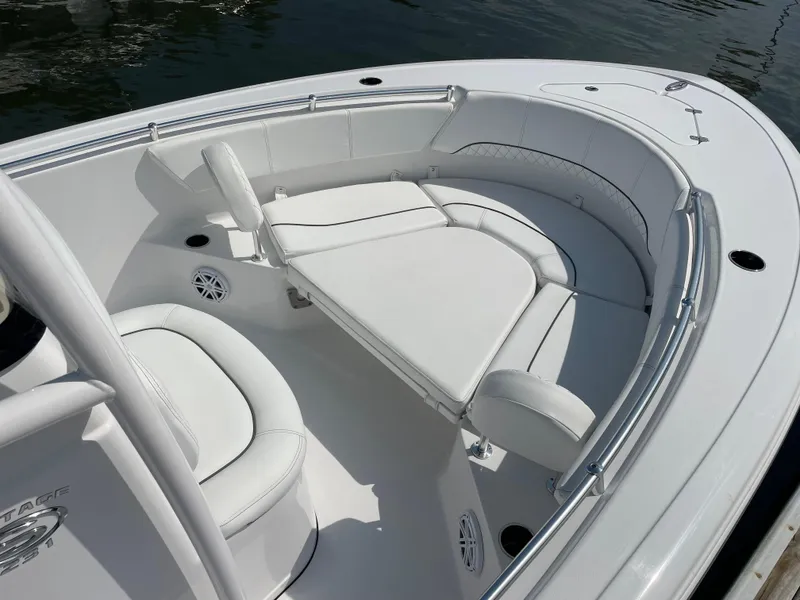 Slide: The Image of 2023 Sportsman Heritage 231 Center Console boat with white cushioned seating. - 7