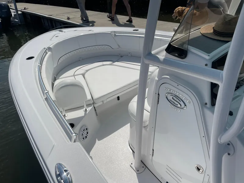 Slide: The Image of 2023 Sportsman Heritage 231 Center Console boat with white seating and console. - 8