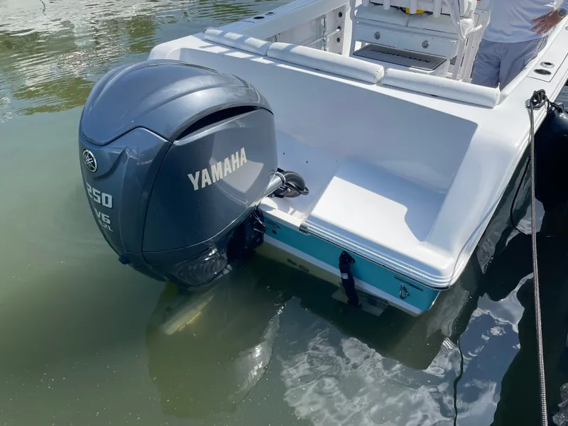 Slide: The Image of 2023 Sportsman Heritage 231 Center Console with Yamaha outboard motor in water. - 9