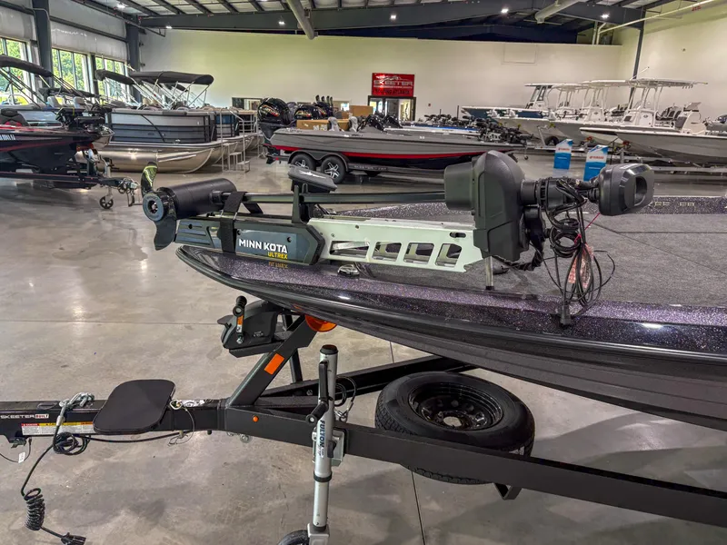 Slide: The Image of 2025 Skeeter ZXR 21 SE boat with Minn Kota Ultrex motor in showroom. - 6
