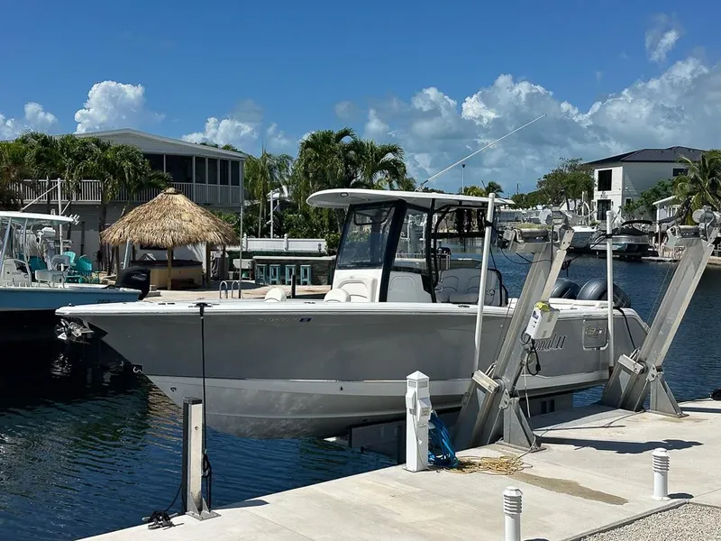 The Image of 2019 Sea Hunt Ultra 275 SE boat on trailer under cloudy sky. - 0