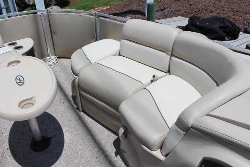 Slide: The Image of 2011 Harris FloteBote 250 Royal Heritage pontoon boat with beige seating and table. - 10