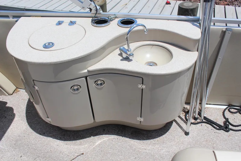 Slide: The Image of 2011 Harris FloteBote 250 Royal Heritage boat sink and storage area. - 14