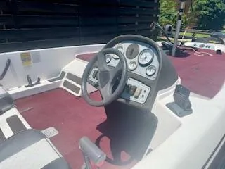 Slide: The Image of 1999 G3 Pro G185 boat interior with steering wheel and dashboard controls. - 6