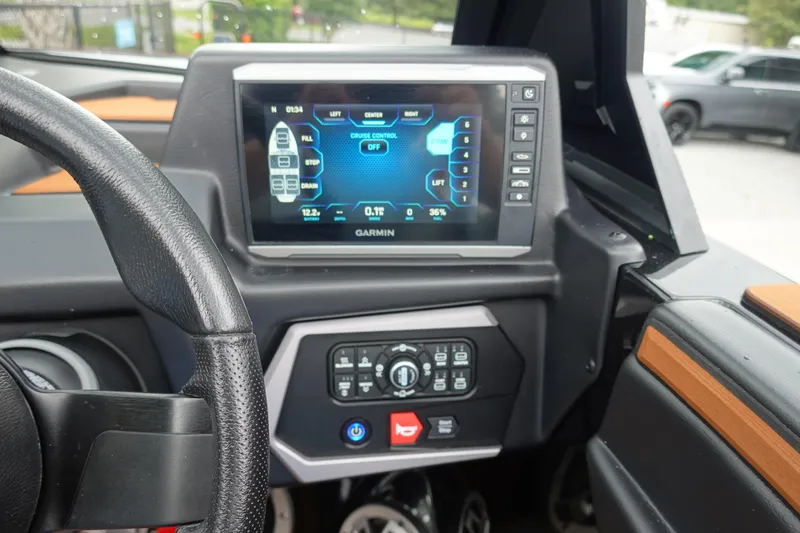 Slide: The Image of Dashboard of 2023 Axis T250 boat with Garmin display and controls. - 13