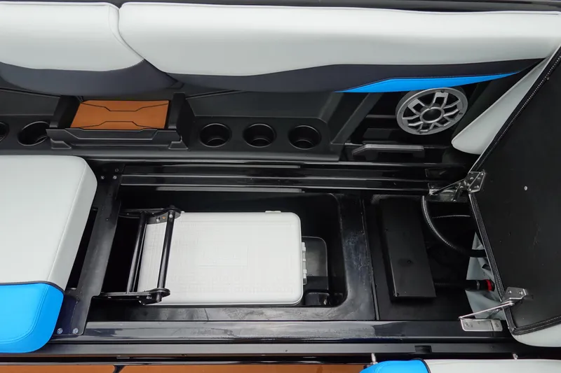 Slide: The Image of 2023 Axis T250 boat interior with storage compartment and speaker system. - 19