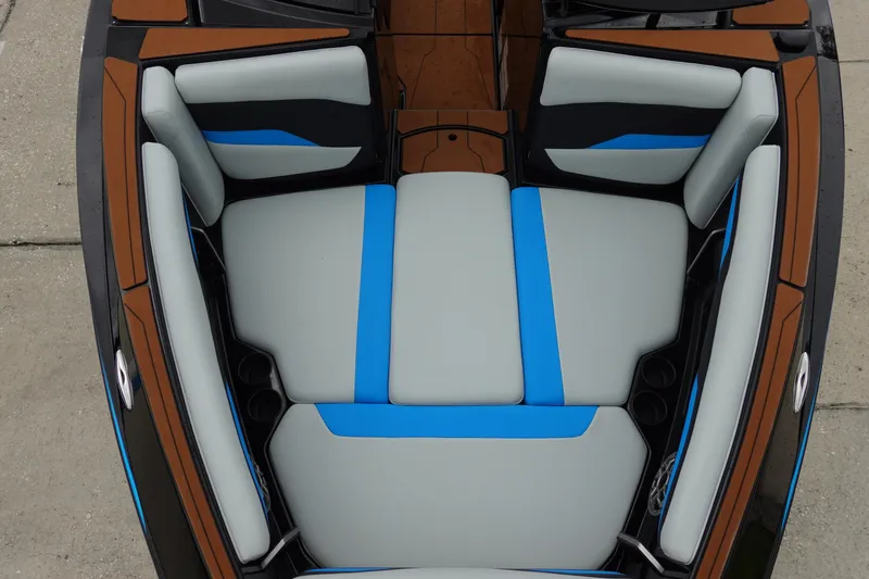 Slide: The Image of 2023 Axis T250 boat interior with gray and blue cushioned seating. - 30