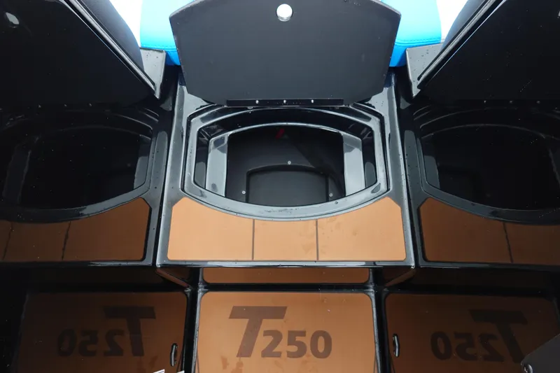 Slide: The Image of 2023 Axis T250 boat storage compartments with open lids, showcasing interior design. - 31