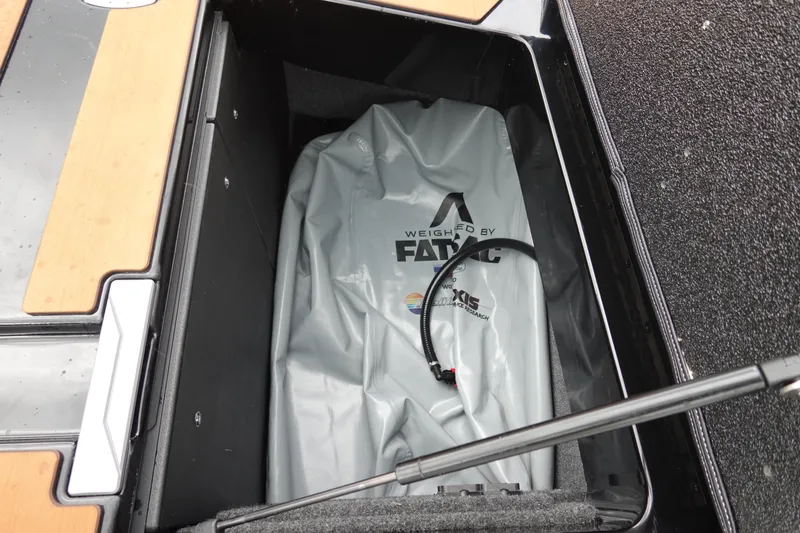 Slide: The Image of Open storage compartment in 2023 Axis T250 boat with FatSac ballast bag. - 33