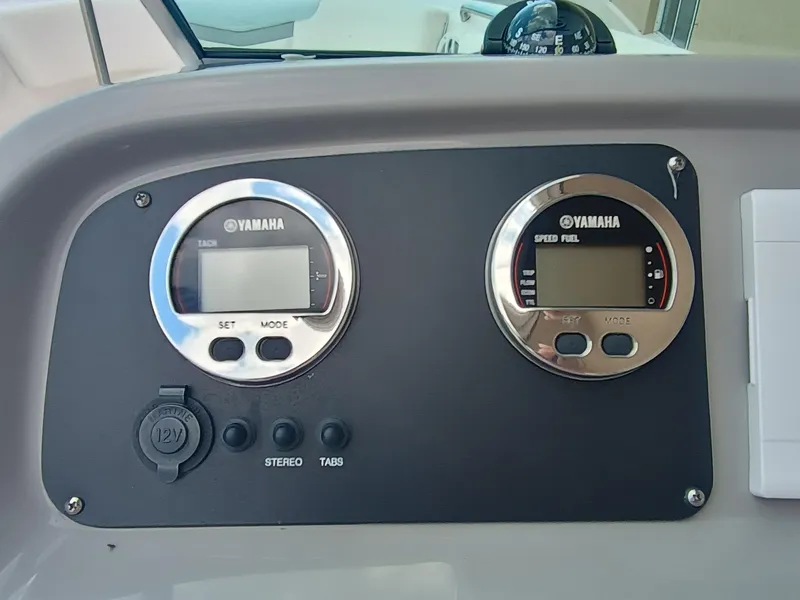 Slide: The Image of 2024 Robalo R207 Dual Console dashboard with Yamaha gauges and controls. - 14
