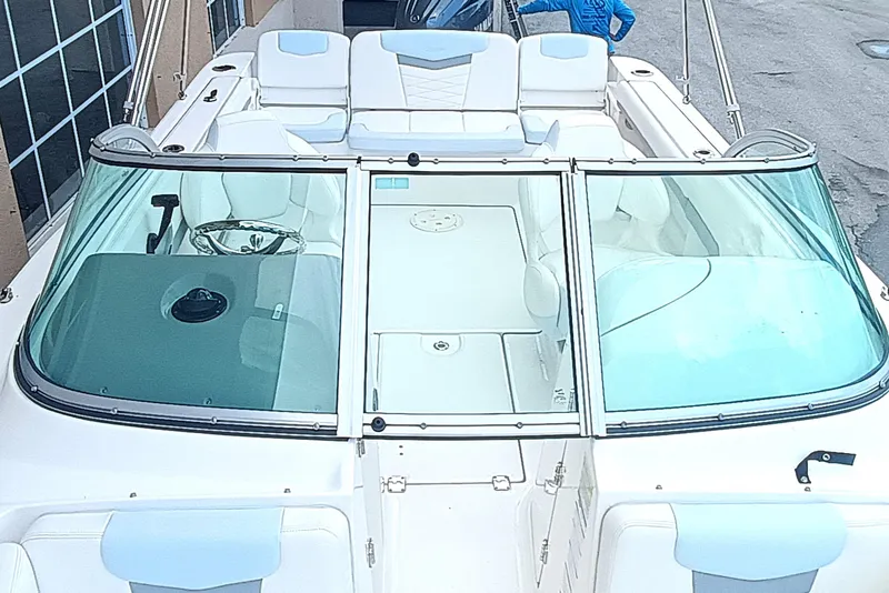 Slide: The Image of 2024 Robalo R207 Dual Console boat with spacious seating and sleek design. - 22