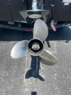 Slide: The Image of Propeller of 2017 Tracker Pro Team 195 TXW boat on asphalt surface. - 8