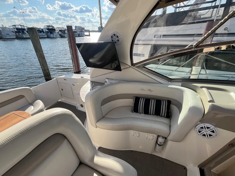 Slide: The Image of Interior of 2002 Sea Ray 320 Sundancer yacht with seating and water view. - 14