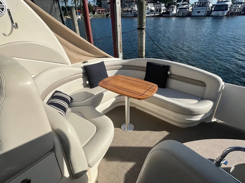 Slide: The Image of Luxurious seating area on 2002 Sea Ray 320 Sundancer yacht with waterfront view. - 15