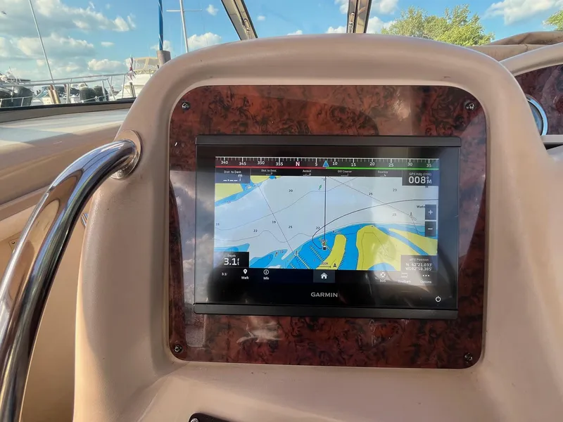 Slide: The Image of Garmin navigation display on 2002 Sea Ray 320 Sundancer boat dashboard. - 18