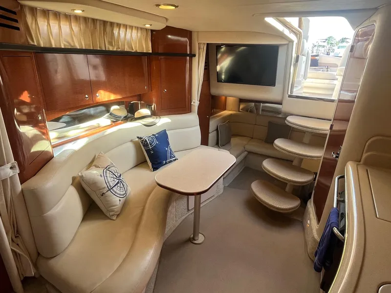 Slide: The Image of Luxurious interior of 2002 Sea Ray 320 Sundancer yacht with plush seating and elegant decor. - 23