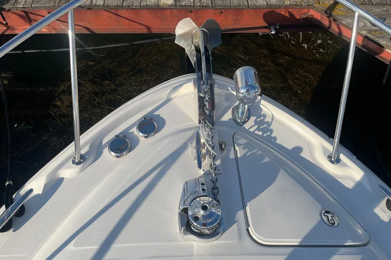 Slide: The Image of Bow of 2002 Sea Ray 320 Sundancer with anchor and chain mechanism. - 5