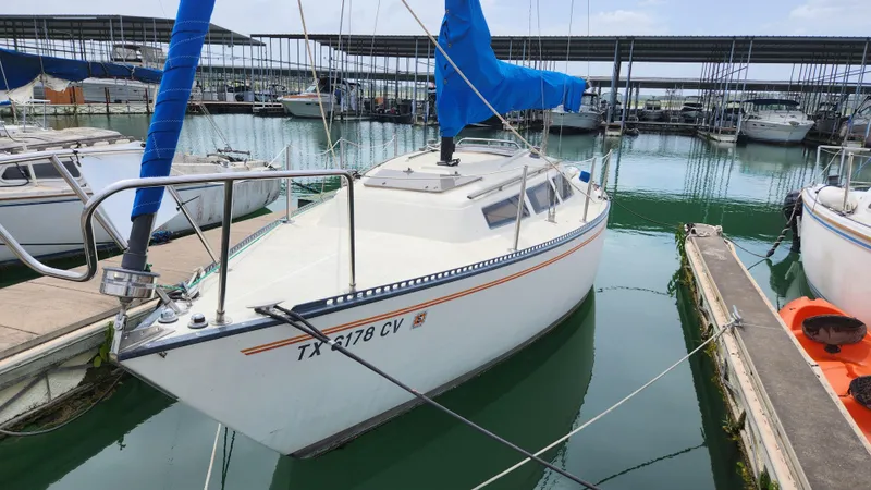 Slide: The Image of 1980 S2 7.3 sailboat docked in marina with blue sail cover. - 2