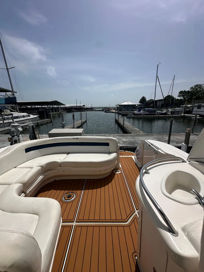 Slide: The Image of 2005 Sea Ray 340 Sundancer boat interior with seating, docked at marina. - 42