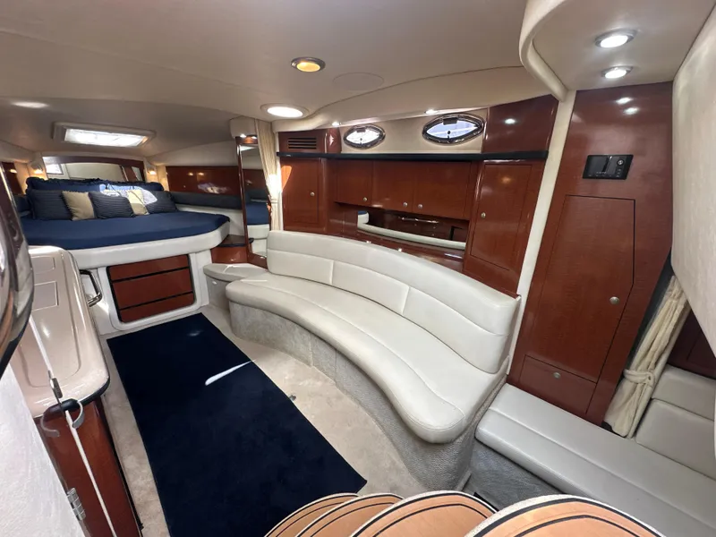 Slide: The Image of Luxurious interior of 2005 Sea Ray 340 Sundancer yacht with elegant seating and cozy sleeping area. - 44