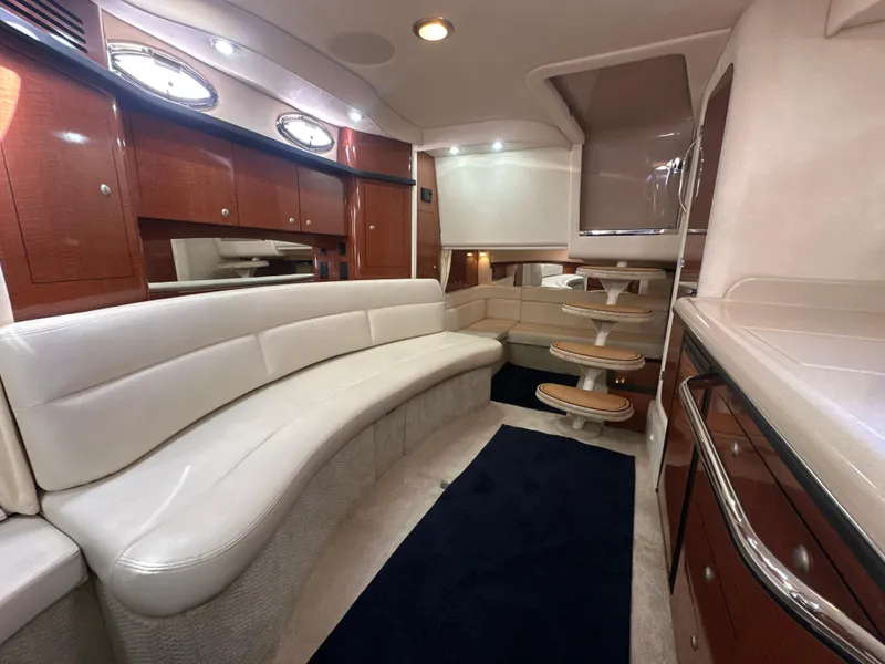 Slide: The Image of Luxurious interior of 2005 Sea Ray 340 Sundancer yacht with elegant seating and cabinetry. - 47