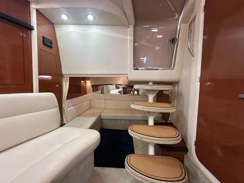 Slide: The Image of Interior of 2005 Sea Ray 340 Sundancer yacht with elegant seating and staircase. - 48